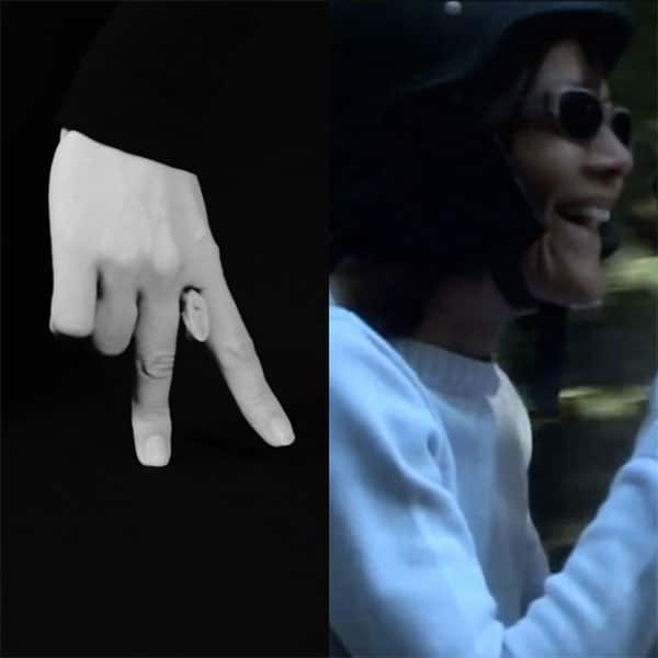 Une femme photographiée de profil qui sourit et une main faisant le signe V inversé